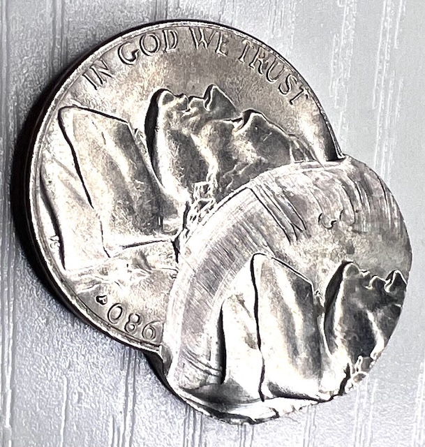 1980 Jefferson nickel double struck error showing overlapping second impression of the Jefferson and Monticello designs