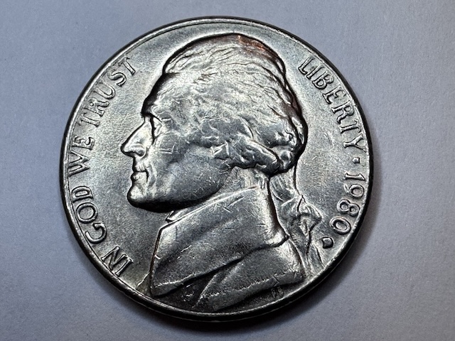 Close-up of 1980 Jefferson nickel obverse showing doubled die error with visible doubling on LIBERTY inscription